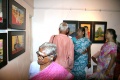 Lakshmiamal looks at her work