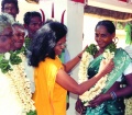Padma Venkatarama gives  the student Uma a flower- girland