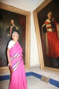 Lakshmiammal infront of monumental paintings