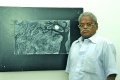 B. Ramachandran in front of his painting