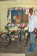 Udaya Kumar with his blessed bicycle.jpg