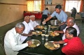 The guests effected by leprosy enjoying to be served at lunch