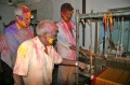 Subiah, Vadivel and Kumar fascinated about the weaving looms