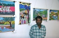 Balachandran stands proud in front of his painting