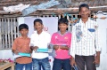 Boys from Bharathapuram getting presents for their performance.jpg