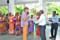 Werner handing over all Bindu paintings created on the competition as a gift to RSO for all their help the last ten years