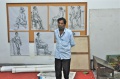 P. Balachandran lshows his paintings on his mobile