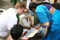 A student explain her work to a guest