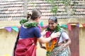 A new student get a mala as a symbol of respect