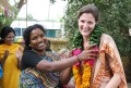 A student present a Mala to a guest