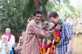 KUMAR  gives a Mala to a guest