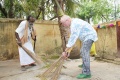 Tone Fink and Loganathan are cleaning the school courdyard