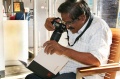 A Journalist fotografs a image from the Bindu-cataloque