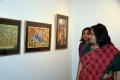 Principal Mrs. Anita Pauline Dey looks to the paintings.JPG