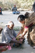 Mrs. Raman gives fruits to the patients.JPG