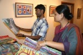 Visitors exploring the paintings