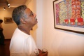 Man looking at Ranis painting