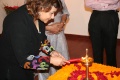 Nisha Singh lighting the lamp