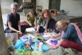 Erica Harris, Annaick, Lauren & Megan painting with the new students