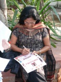 Padma Venkataraman signing the diplomas