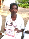 Subramani showing his diploma