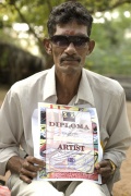 Udayakumar showing his diploma