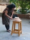 Padma cutting the fifth birthday cake