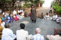 Padma playing a parcel game with the students