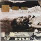 A starving woman bedded on a  five Dollar note, covered with gold leaf