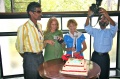 B. Ramachandran photographs the cake and the students