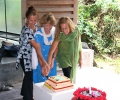 Aurosisters, Christine, Dianna and Tia cutting the birthday cake