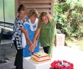 Aurosisters, Christine, Dianna and Tia cutting the birthday cake
