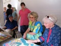 Visitors fascinated in Bindu paintings