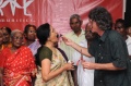 Werner feeding Padma the Bindu birthdaycake