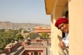 Munusamy looking through a window of the Hawa Mahal