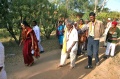 Students and Padma walking along Ramigarh Re-Integration Center