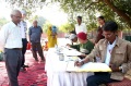 Guests watching the artist during the workshop