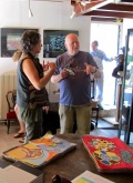 Francois Koenig explains the show to a local Artist