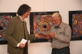 Dr. Gerald Wünscher hands over a present to Andreas Maleta for his speech and help