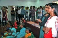 Guests and artists listening to the speeches