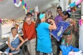 Christine Rhone giving the Bindu students a Queen bannar