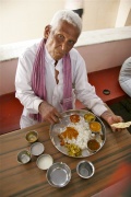 Munusami enjoying his meal