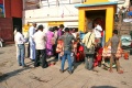 Students surrounded by people selling souveniers