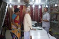 Munusami buying some saris for his relatives