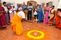 Student V. Sundari lighting the lamp