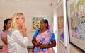 Uma explains her paintings