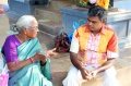 Rani talks to the christian priest Olivier