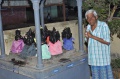 P. Eswaran with the idols of different gods